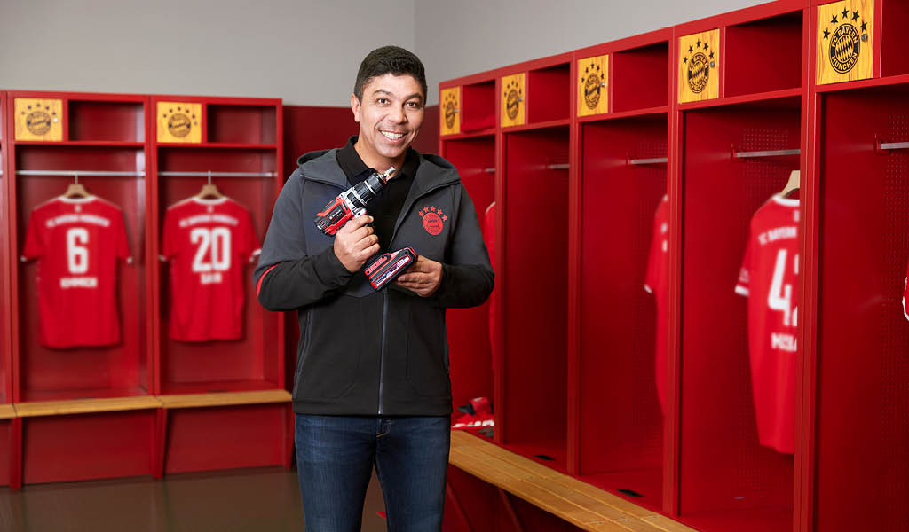 man with battery screwdriver in the locker rooms